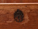 a close up of a wooden bench with a wood seat