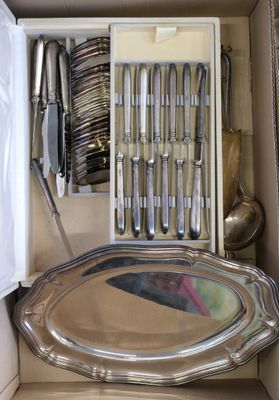 a box with silverware and utensils inside of it
