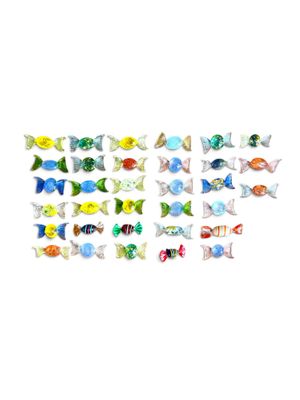a close up of a bunch of small fish on a white surface