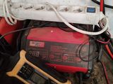 a red and black electrical device and a yellow and black electrical device