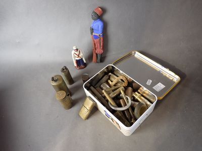 a small toy figure standing next to a box of tools