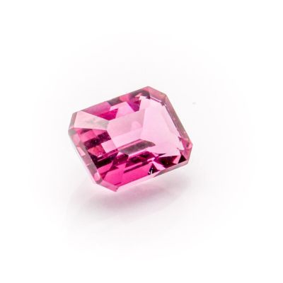 a pink tourmaline gems on a white background
