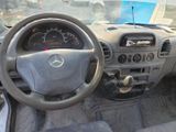 dashboard of a car with a steering wheel and dashboard gauges