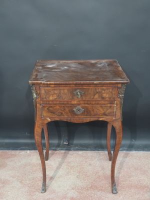 an old wooden table with a drawer on top of it