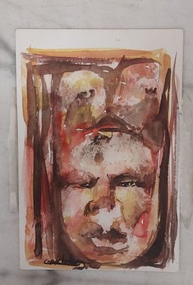 une peinture représentant le visage d'un homme sur une feuille de papier