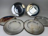 six silver plated plates with a silver rim and a silver rim