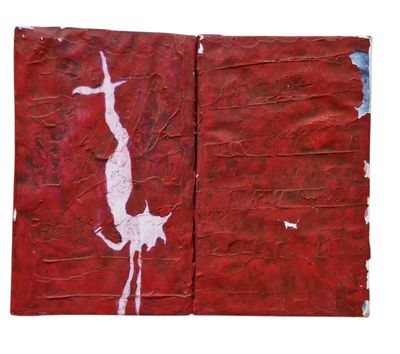 un livre rouge sur lequel figure l'image d'un homme et d'un chien