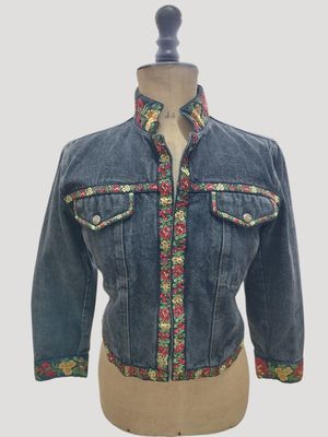 a close up of a mannequin mannequin wearing a jean jacket