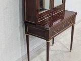 an image of a desk with a mirror on top of it