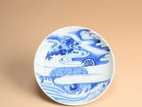 an image of a blue and white plate sitting on a table