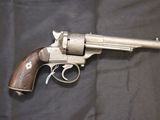 a close up of a revolver on a black background