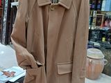 a coat hanging on a rack in a clothing store