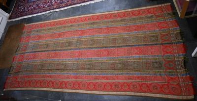 an image of two rugs on display in a room