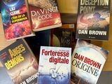 a lot of books that are sitting on a table