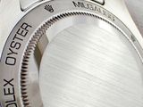 a close up of a watch with a metal band