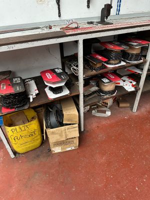 many pairs of shoes that are sitting on a shelf