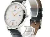 a close up of a wrist watch with a white dial