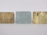 three gold, silver and blue soap bars