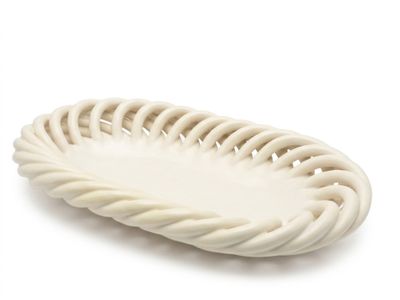 the white plate is shaped like a basket with a rope around it