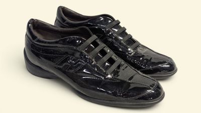 men ' s black dress shoes on a white background
