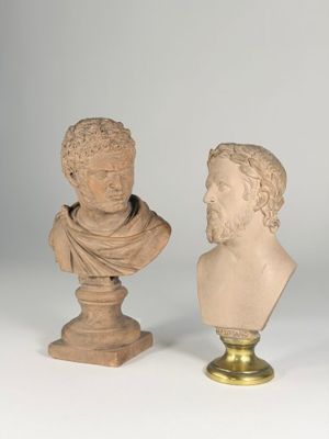 two marble busts of a man and a woman