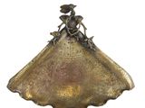 an image of a gold plate with a woman on it