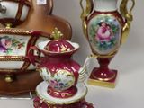a lot of vases that are sitting on a table