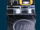 a yellow cell phone sitting on top of a black box