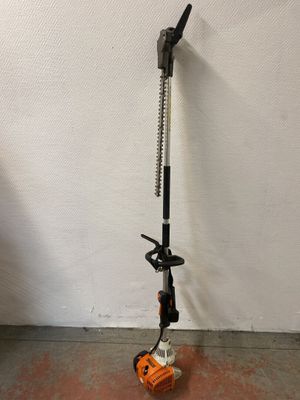 a close up of a small pole with a handle on the ground