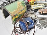 many different types of toy trains and accessories on the table