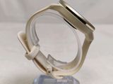 a watch that is sitting on top of a clear stand