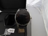 a watch sitting in a case on a table