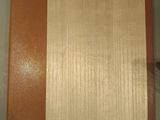 a brown and tan book sitting on top of a table