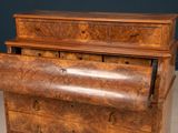 a wooden chest of drawers with a drawer on top of it