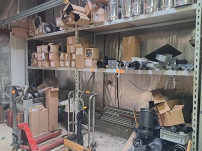 many boxes and boxes on the shelves in the garage