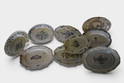 a lot of plates that are sitting on a table