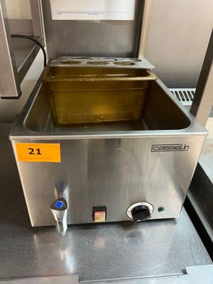 une photo d'une friteuse professionnelle équipée d'un bac jaune