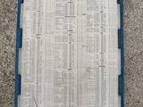 a blue clipboard with a bunch of numbers on it