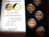 a picture of a certificate of authenticity and authenticity of a coin