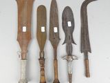 several different types of knifes are displayed on a white surface