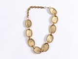 necklace made of gold coins on a white background
