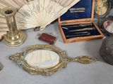 a lot of antique items that are on the table