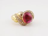 a yellow gold ring with a pink tourmaline and diamonds