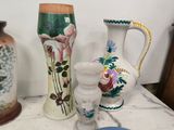 three vases sitting on a table next to each other