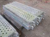 several pieces of metal are stacked on top of each other on the ground
