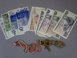 a bunch of money that is laying on a table
