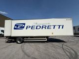 the truck is parked in the parking lot outside of the building