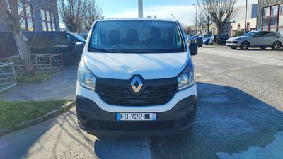 the white van is parked on the side of the road