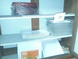 a shelf with a lot of plates on it