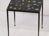 an image of a small table with a black and yellow design on it